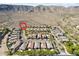 Stunning aerial view of desert community homes nestled against mountains with mature landscaping at 15711 S 11Th Ave, Phoenix, AZ 85045