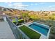 Expansive backyard with a refreshing pool, mountain views, and lush landscaping creating an ideal outdoor living space at 15711 S 11Th Ave, Phoenix, AZ 85045