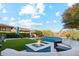 Beautiful backyard with turf, a luxury pool and grill at 15711 S 11Th Ave, Phoenix, AZ 85045