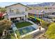 Inviting backyard with a pool, spa, fire pit, covered patio, and mountain views at 15711 S 11Th Ave, Phoenix, AZ 85045