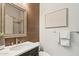 Powder bathroom showcasing modern fixtures, decorative mirror, and a sleek vanity at 15711 S 11Th Ave, Phoenix, AZ 85045