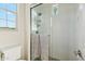 Bright bathroom featuring a glass shower with white subway tile and complementing fixtures at 15711 S 11Th Ave, Phoenix, AZ 85045