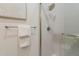 Bathroom featuring sleek shower with frameless glass door and modern fixtures at 15711 S 11Th Ave, Phoenix, AZ 85045