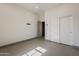 Bright, spacious bedroom features a large closet and neutral tile flooring at 15711 S 11Th Ave, Phoenix, AZ 85045