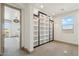Well-lit bonus room featuring custom shelving and window with beautiful view, located off the upstairs hallway at 15711 S 11Th Ave, Phoenix, AZ 85045