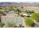 This aerial view showcases basketball and tennis courts with covered picnic areas in a vibrant community setting at 15711 S 11Th Ave, Phoenix, AZ 85045