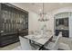 Elegant dining room boasts a wine storage unit and ample seating for formal gatherings at 15711 S 11Th Ave, Phoenix, AZ 85045