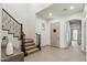 Grand entryway with staircase and view to the home's interior at 15711 S 11Th Ave, Phoenix, AZ 85045