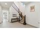 Stately foyer featuring an elegant staircase, tiled floor, and sophisticated decor at 15711 S 11Th Ave, Phoenix, AZ 85045