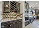 Well-equipped kitchen with stainless appliances, accent lighting, and geometric backsplash at 15711 S 11Th Ave, Phoenix, AZ 85045