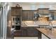 Well-equipped kitchen with stainless steel appliances, a center island, and ample cabinet space at 15711 S 11Th Ave, Phoenix, AZ 85045