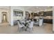 Modern kitchen showcasing dark cabinets, sleek countertops, and a stylish island with bar seating at 15711 S 11Th Ave, Phoenix, AZ 85045