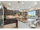 Modern kitchen featuring stainless steel appliances, a large island, and a stylish backsplash at 15711 S 11Th Ave, Phoenix, AZ 85045