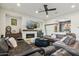 Modern living room with neutral color palette, fireplace, and comfortable seating at 15711 S 11Th Ave, Phoenix, AZ 85045