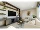 Cozy living room offers custom built-ins and a bright window for a relaxing atmosphere at 15711 S 11Th Ave, Phoenix, AZ 85045