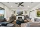 Bright and modern living room with a fireplace, contemporary furnishings, and large windows at 15711 S 11Th Ave, Phoenix, AZ 85045