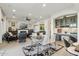Spacious living room with fireplace, comfortable seating, dining area, and view of the kitchen at 15711 S 11Th Ave, Phoenix, AZ 85045