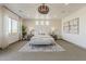 Inviting main bedroom with plush carpet, recessed lighting, and decorative window treatments at 15711 S 11Th Ave, Phoenix, AZ 85045