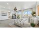 Comfortable main bedroom suite featuring a sitting area and access to a balcony at 15711 S 11Th Ave, Phoenix, AZ 85045