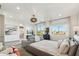 A spacious main bedroom features a sitting area, an ensuite, and large windows overlooking the mountains at 15711 S 11Th Ave, Phoenix, AZ 85045