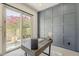 Bright home office showcasing backyard scenery, modern décor, and a stylish feature wall at 15711 S 11Th Ave, Phoenix, AZ 85045