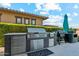 Outdoor kitchen with stainless steel appliances for luxury outdoor living at 15711 S 11Th Ave, Phoenix, AZ 85045