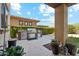 Outdoor kitchen with built-in grill, cabinets, and a landscaped patio area at 15711 S 11Th Ave, Phoenix, AZ 85045