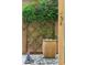 Charming patio featuring a water feature, climbing vines, and a decorative cat statue creating a serene outdoor space at 15711 S 11Th Ave, Phoenix, AZ 85045