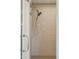 A glass-enclosed shower features a shower head and bright tile at 15711 S 11Th Ave, Phoenix, AZ 85045