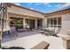 Spacious backyard patio with shaded seating and a sunny area, ideal for relaxing and entertaining at 16158 W Copper Point Ln, Surprise, AZ 85374