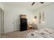 Bright bedroom with a carpet and a view through the window at 16158 W Copper Point Ln, Surprise, AZ 85374