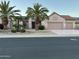 Inviting single-story home showcases desert landscaping, a three-car garage, and a welcoming front entrance at 16158 W Copper Point Ln, Surprise, AZ 85374