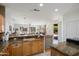 Bright and airy kitchen featuring granite counters, stainless appliances, and backyard access at 16158 W Copper Point Ln, Surprise, AZ 85374