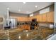 Spacious kitchen with granite countertops, stainless steel appliances, and ample cabinet space at 16158 W Copper Point Ln, Surprise, AZ 85374