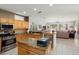 Open kitchen featuring granite countertops, stainless steel appliances, and ample cabinet space at 16158 W Copper Point Ln, Surprise, AZ 85374