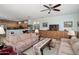 Comfortable living room with tile floors and an open connection to the kitchen at 16158 W Copper Point Ln, Surprise, AZ 85374