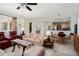 Open living room showcases tile floors, comfortable seating, and seamless flow to the kitchen at 16158 W Copper Point Ln, Surprise, AZ 85374
