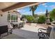 Covered patio overlooks a meticulously landscaped backyard, offering a serene outdoor living space at 16158 W Copper Point Ln, Surprise, AZ 85374