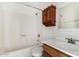 Bathroom features a tub and shower combo, and a wood vanity with plenty of storage space at 1634 E Donner Dr, Tempe, AZ 85282