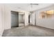 This bedroom features gray carpet, a window, and a mirrored closet at 1634 E Donner Dr, Tempe, AZ 85282