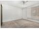 This primary bedroom includes carpet, a ceiling fan and bright natural light at 1634 E Donner Dr, Tempe, AZ 85282