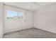 This bedroom features carpet flooring, neutral walls, and a sunny window with outdoor views at 1634 E Donner Dr, Tempe, AZ 85282