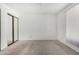 A neutral bedroom features carpet, a sliding door closet and bright natural light at 1634 E Donner Dr, Tempe, AZ 85282