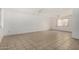 Bright living room offering neutral walls and tile flooring for easy maintenance at 1634 E Donner Dr, Tempe, AZ 85282