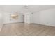 Spacious living room features tile flooring, ceiling fans, and natural light from windows at 1634 E Donner Dr, Tempe, AZ 85282