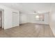 Bright living area includes tile flooring, a ceiling fan, and access to other rooms in the home at 1634 E Donner Dr, Tempe, AZ 85282