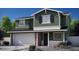 Charming two-story home featuring a two-car garage, a welcoming front porch, and a beautifully landscaped yard at 16875 N 12Th St # 13, Phoenix, AZ 85020