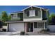 Charming two-story home featuring an attached two-car garage and neutral landscaping in front at 16875 N 12Th St # 13, Phoenix, AZ 85022