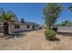 Exterior backyard view features desert landscaping and a view of the home at 1708 W Estrella Dr, Chandler, AZ 85224