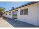Exterior backyard featuring windows, sliding door and a desert landscaped yard at 1708 W Estrella Dr, Chandler, AZ 85224